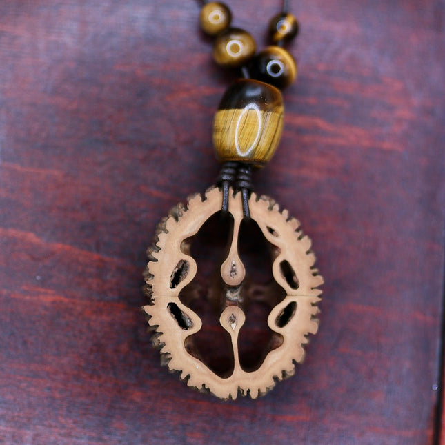 Schwarznuss Scheibe – Tigerauge groß